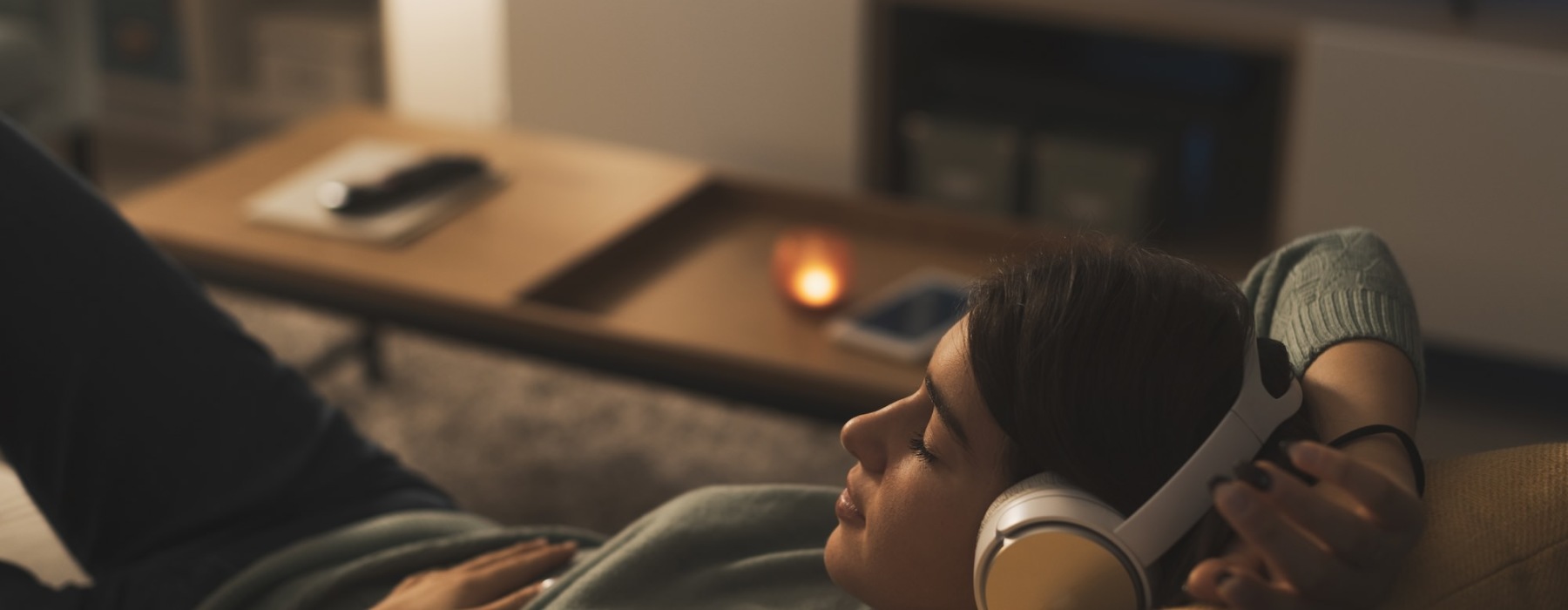 a person on the couch with headphones on