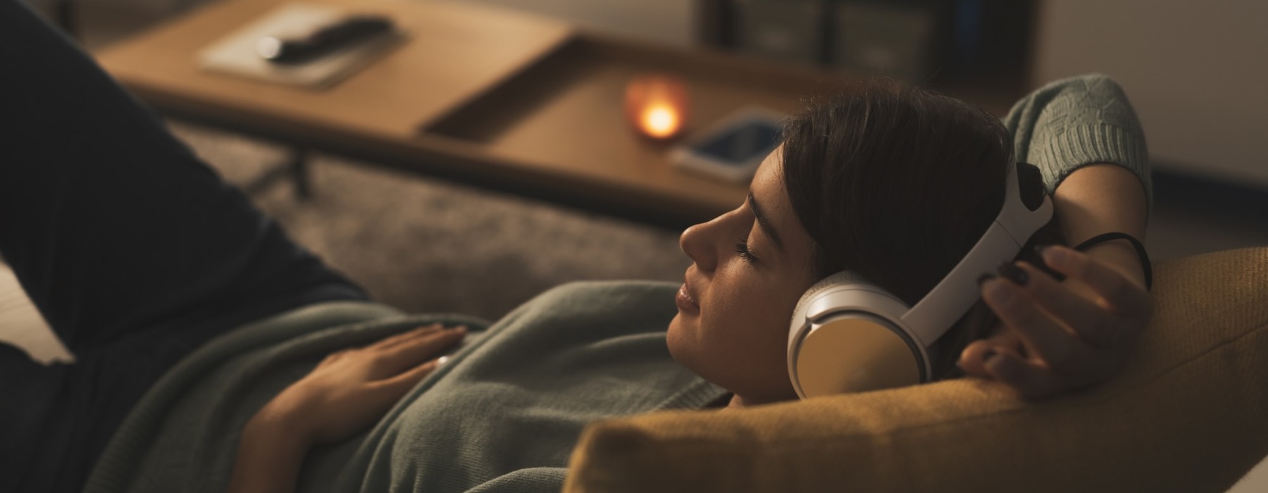 a person on the couch with headphones on